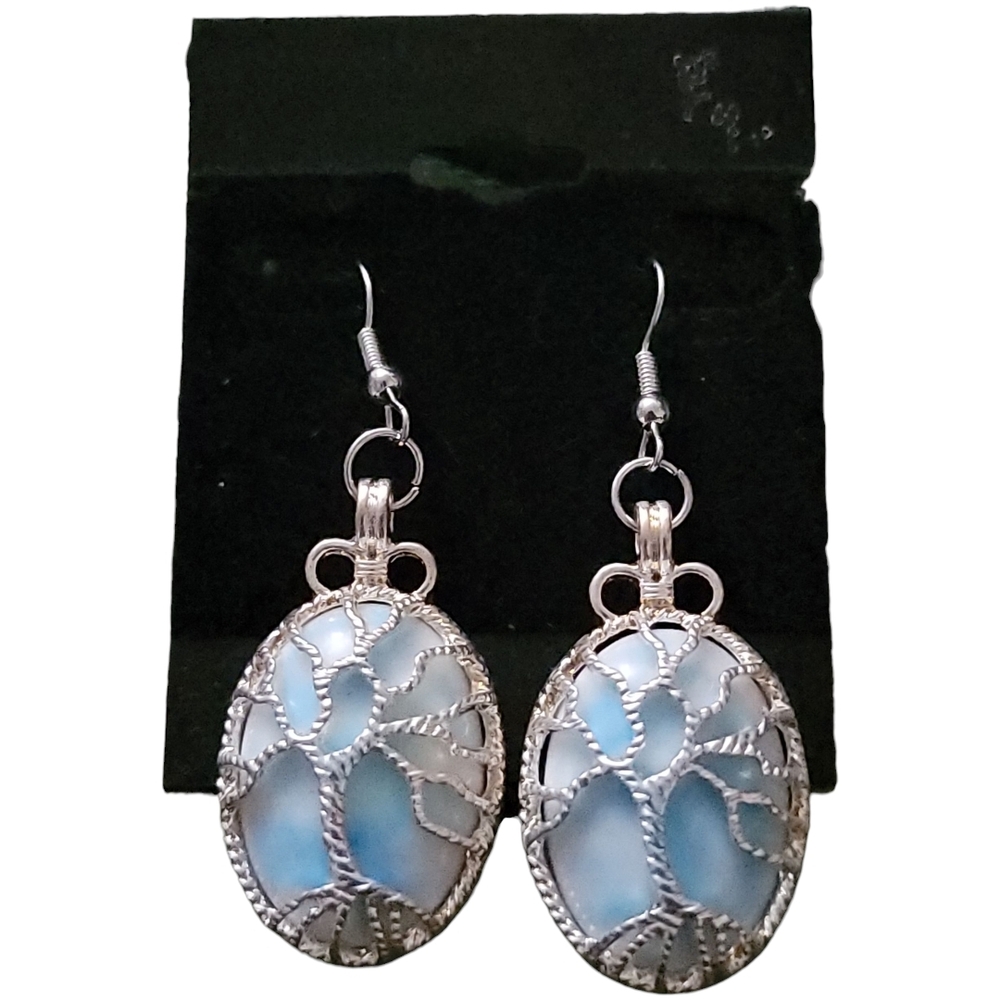 Silver-toned earrings with a Larimar gemstone, featuring a tree of life design.